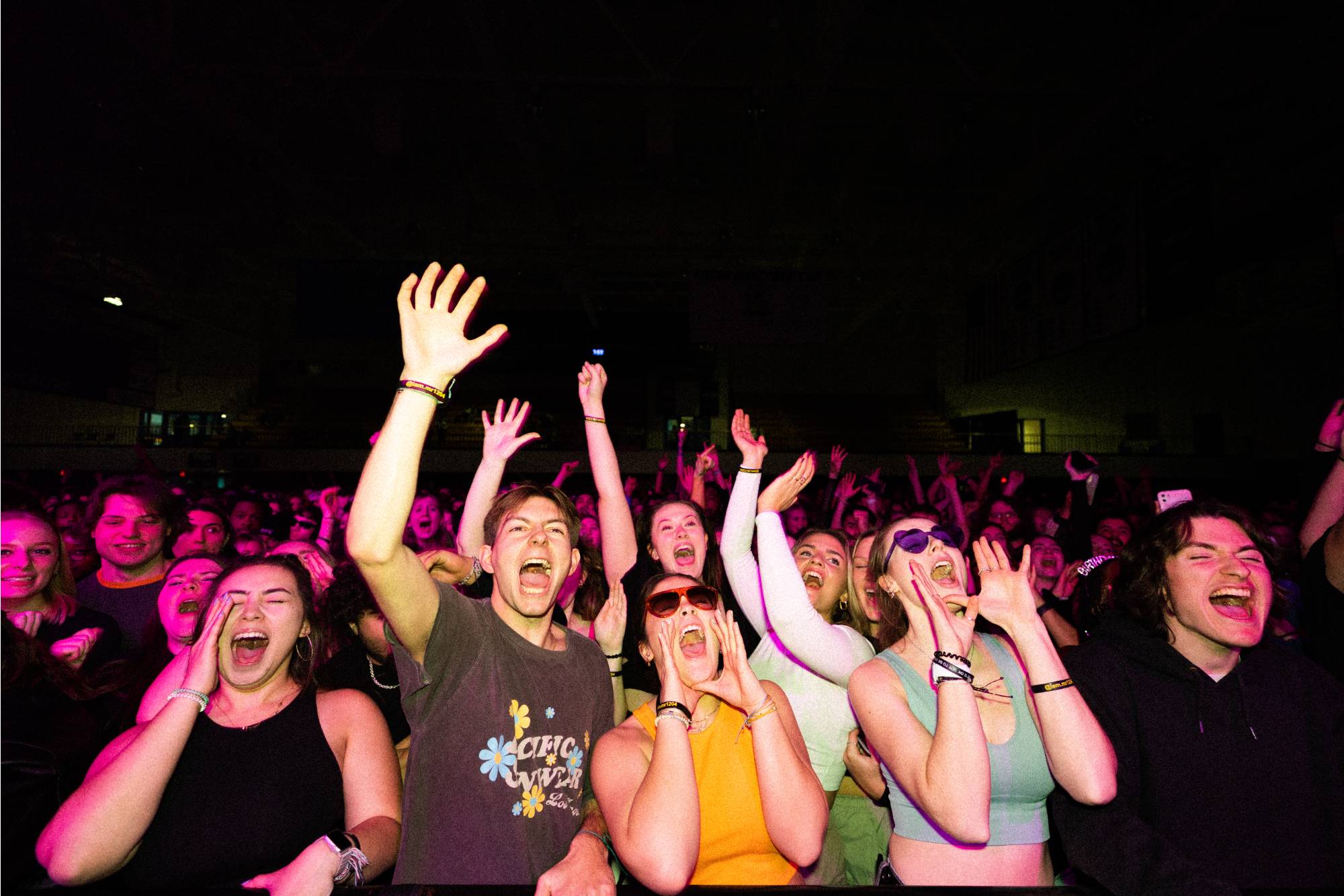 Students cheering in the audience at spring concert